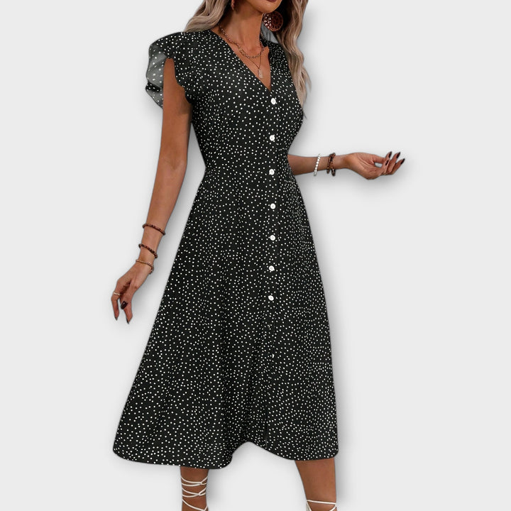 Vestido midi elegante con lunares